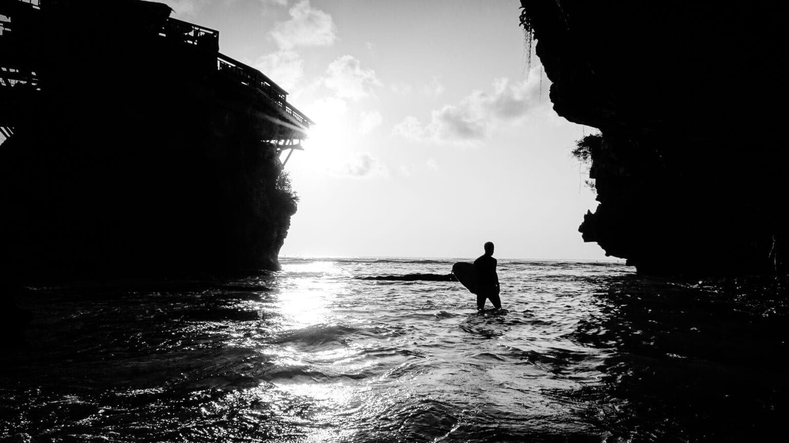 Uluwatu Blue Point Beach surfer, Bali, Indonesia